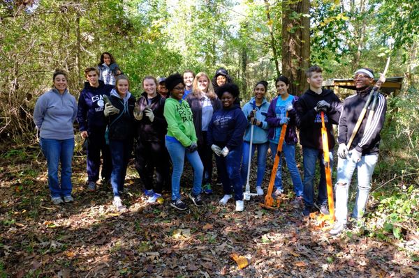 A group of volunteers helping pull privet. Thanks y'all!