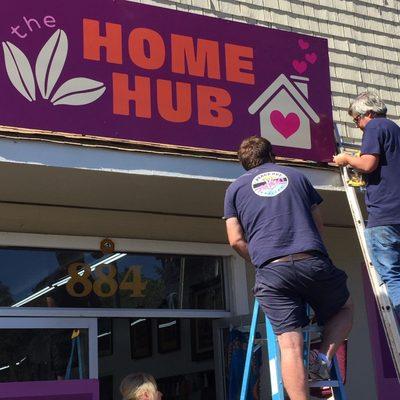 Chad and Brett, of our sister company, Peace Out Junk Hauling, installing our awesome new roof sign!