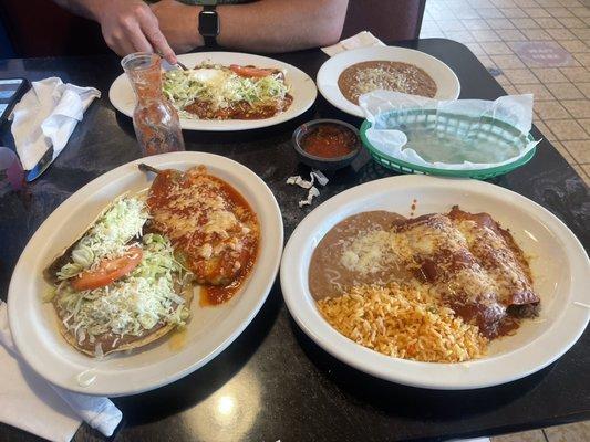 Enchiladas Tapatias and side order of Refried Beans on the far side  House Dinner two plates closest