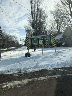 Sign for the diner as seen from the road.