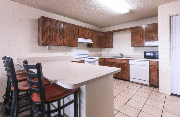 Kitchen with bar seating.