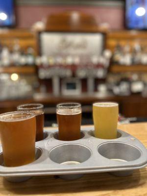 Beer sampler in a muffin tin.