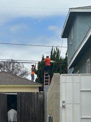 Guys working  in backyard without permission