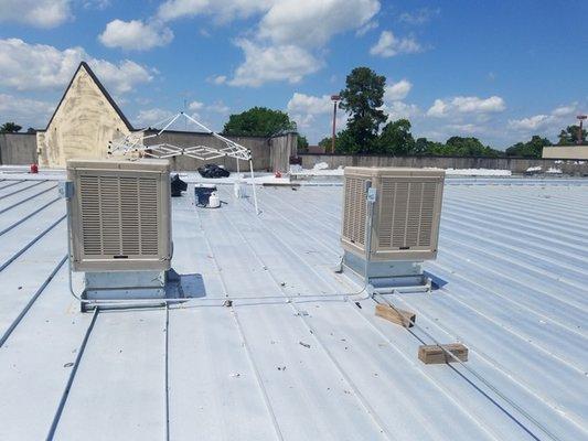 Commercial metal roof in progress in Houston (Woodforest strip center)