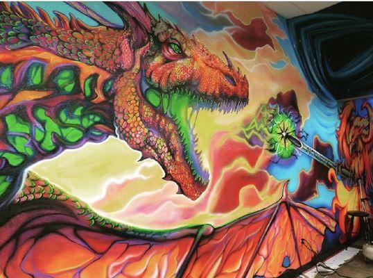 The mesmerizing mural portrays an enchanting dragon, its scales vividly aglow in the dark.