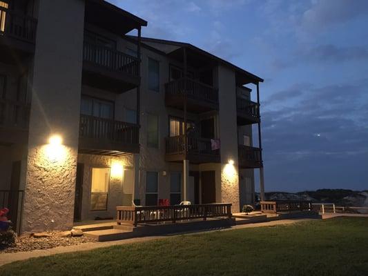 Night time view of the side of the building