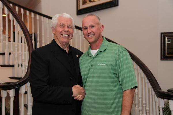 Charley Cash with Bill Austin, the founder and CEO of Starkey Hearing Technologies.