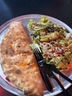 This place never fails me  A calzone with salad