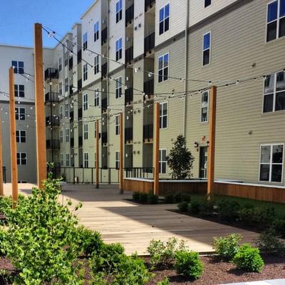 The planting and wood features by Complete at the Esplanade Apartments at National Harbor