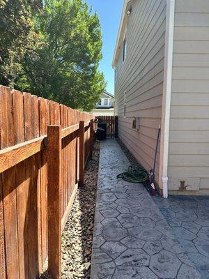 After: completed stamped concrete sidewalk from backyard to front of house.