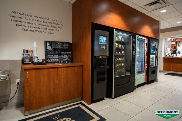 Vending machine area with complimentary coffee from Rooted Grounds Coffee