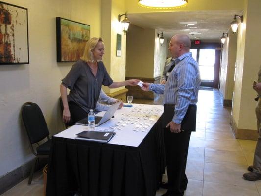 Candidates signing in before the conference begins.