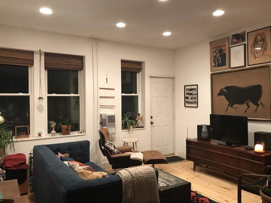 After pic of living room. New floors, drywall, lights, windows, everything