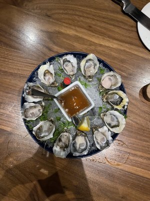 Here with my beautiful wife, again, 13 days later. In the photo are higata oysters on half shell. Delicious.