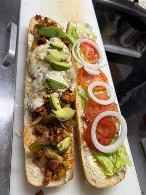 Torta (Mexican Style poboy) 
Filled with choice of meat, beans, cheese, lettuce, tomato, onion, avocado, and pickled jalapenos