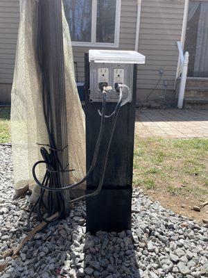 Outdoor outlet install with wooden frame