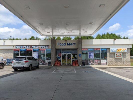 Outside. Food Mart convenience store storefront.