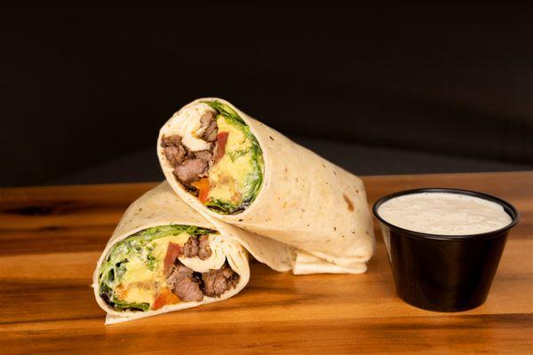 Wrap filled with juicy
beef fajita, crispy
bacon, Romaine
lettuce, tomato,
guacamole, pico de
gallo, and signature
blue cheese.