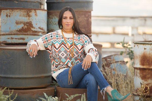 Earth tones and Aztec print make the perfect combination.  An accent choker style necklace with turquoise squash blossom complete the outfit