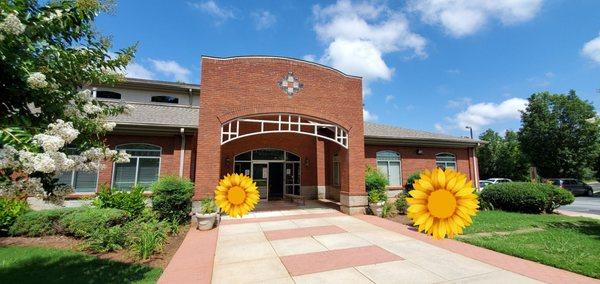 This is the building. The sunflowers are covering two people for their privacy.