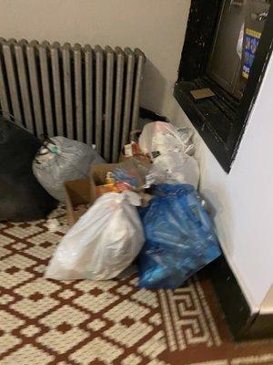 Constant pile of garbage in the entryway. It's disgusting.