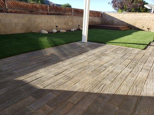 Lawn Kings built a wooden deck, along with the installation of artificial grass and pavers.