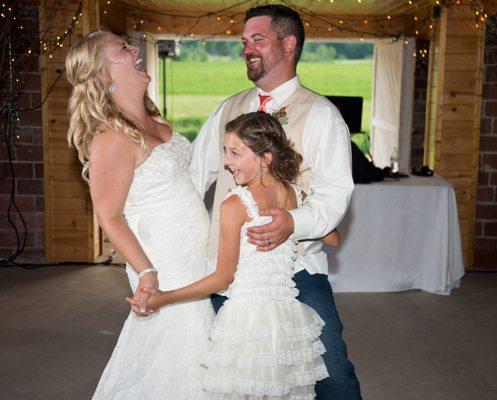 couple and daughter at barn in Willow River. MN.