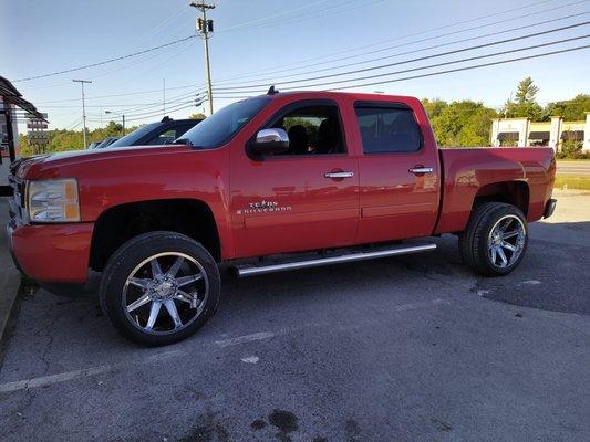 Lift kit and new 22x12 chrome wheels.