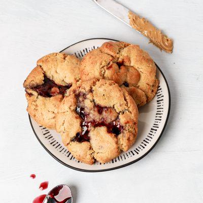 PB&J Gooey Butter Cookie. A crisp, chewy cake like Peanut butter cookie filled with peanut butter, grape jam and peanut butter morsels.