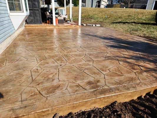 14 x 18 Stamped - Colored concrete patio with flagstone pattern .