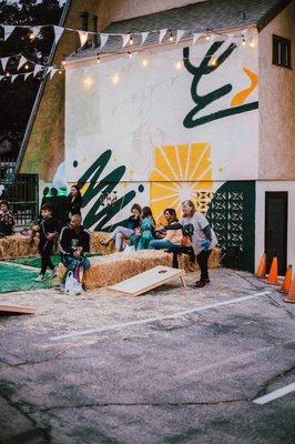 Cornhole at treat Yo self night