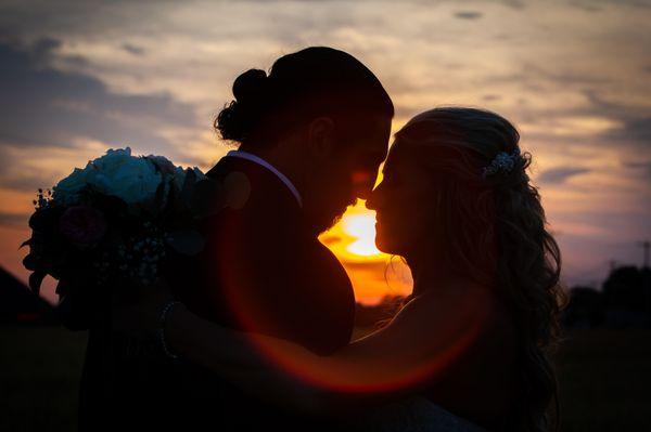 Sunset wedding photo with George and Katie