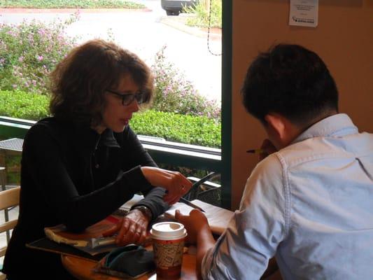 Reviewing student's writing at a Mountain View cafe.