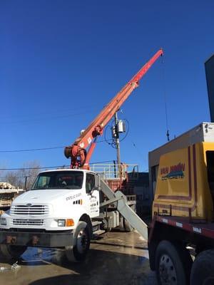 Large crane for reaching over building and other obstacles.