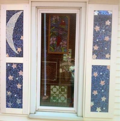 The mosaic shutters were made in a workshop by friends of the store.