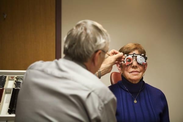 Jerry D. Cavallerano, O.D., Ph.D., Optometrist at the Beetham Eye Institute, giving a patient her eye exam