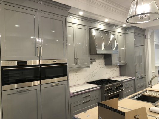 Kitchen cabinets refinished in high gloss on a project in Back Bay.