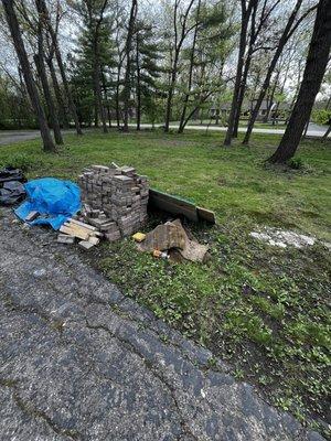 Left all this in my front yard.   He also left garbage (literally) and toxic chemicals under the tarp.