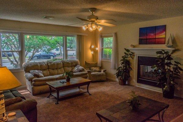 Living room ~ Two way fire place looking into den Sleep sofa Queen, with memory foam mattress