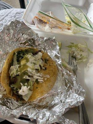 Steak taco.  Plus sour cream and lettuce from the quesadilla.  Added her homemade green salsa too.