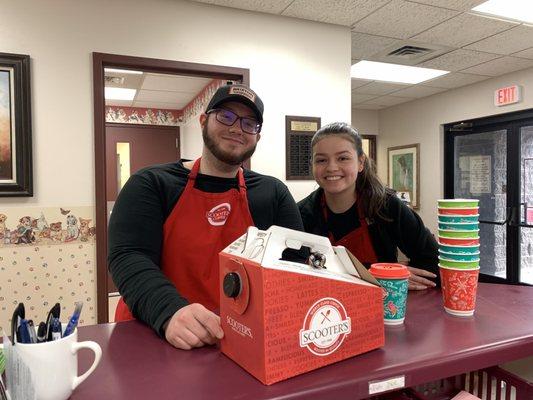 Store GM - Brandon Mitchell and Supervisor - Alyssa Garcia donating coffee to Muscatine Humane Society