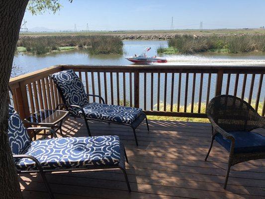 Enjoy watching boats go by off the comfort of your private deck.