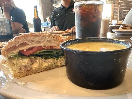 Curried chicken salad on a croissant (half portion) with potato and carrot soup.