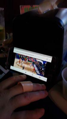 Us watching game on my phone at Bar! WTH...