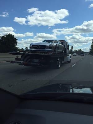 Mercedes being towed.