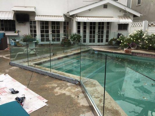 Glass rail pool enclosure