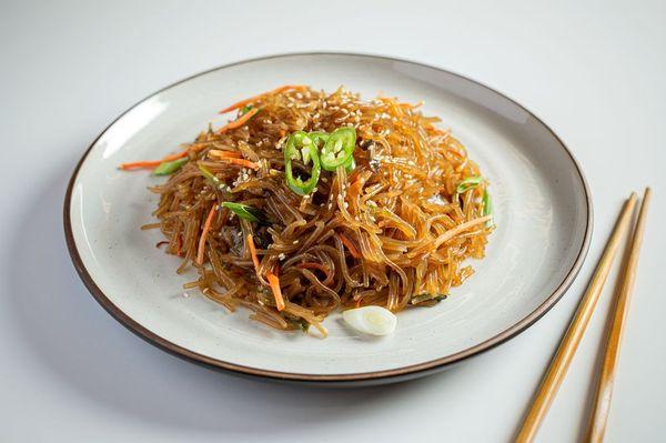 Japchae

a sweet and savory dish of stir-fried glass noodles and vegetables that is popular in Korean cuisine