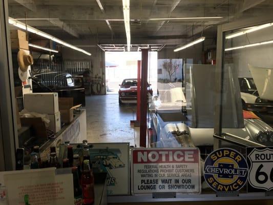 Inside of the shop. Everything from a late model Ford Explorer out back to a first generation  Corvette getting work done