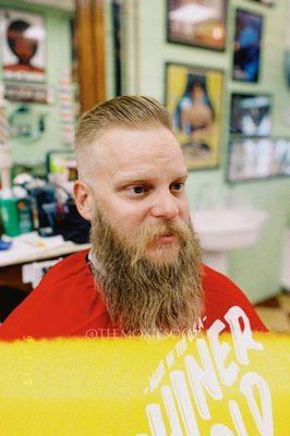 Side part mid fade with beard trim