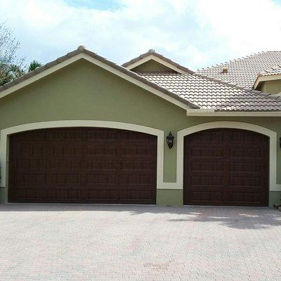 16x8 and 9x8 Amarr 1000 with walnut finish in Davie...Installed by A Plus Mega Overhead Doors Inc. Lic#15-GD-19589-*